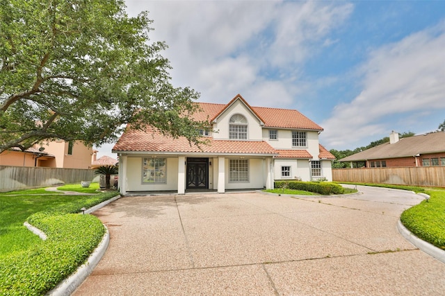 4603 Joyce Blvd, Houston, TX 77084 - mediterranean / spanish-style home featuring stucco siding, a tiled roof, and driveway