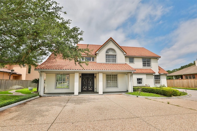 4603 Joyce Blvd, Houston, TX 77084 - mediterranean / spanish-style home with fence, stucco siding, and a tile roof
