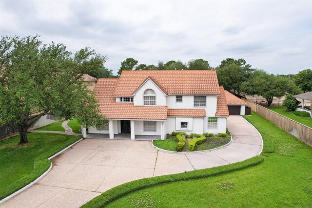 4603 Joyce Blvd, Houston, TX 77084 - mediterranean / spanish-style home with a tile roof, stucco siding, a garage, and driveway