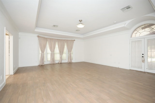 4603 Joyce Blvd, Houston, TX 77084 - spare room featuring a raised ceiling, wood finished floors, ornamental molding, french doors, and baseboards