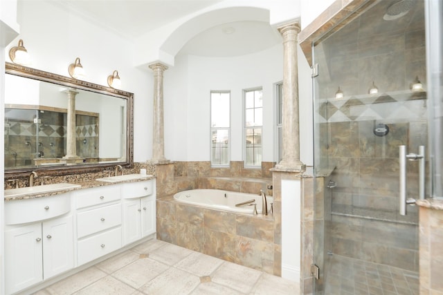 4603 Joyce Blvd, Houston, TX 77084 - full bathroom featuring ornate columns, a stall shower, a garden tub, double vanity, and ornamental molding