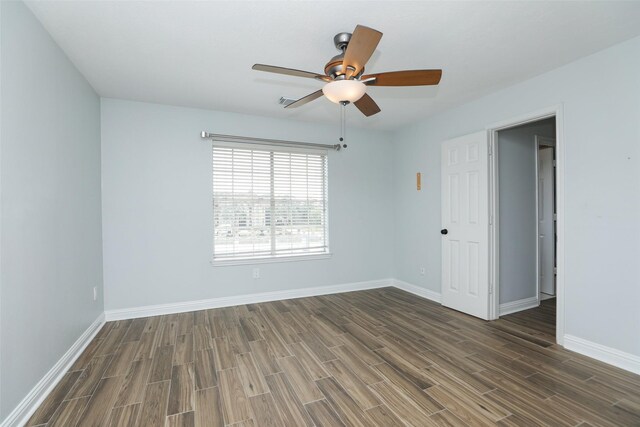 4603 Joyce Blvd, Houston, TX 77084 - empty room with dark wood-style flooring, a ceiling fan, and baseboards