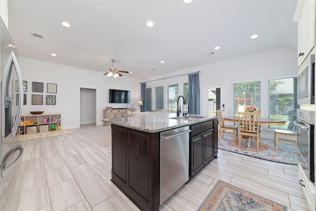 kitchen with stainless steel appliances, a sink, plenty of natural light, a ceiling fan, and recessed lighting