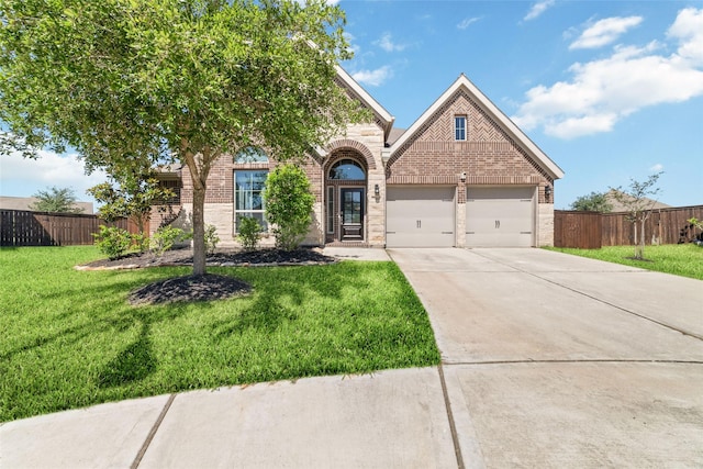 view of front of house with brick siding, driveway, and an attached garage