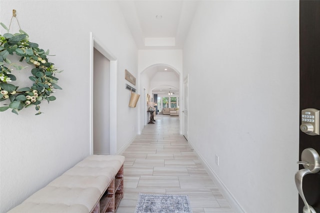 hallway featuring arched walkways