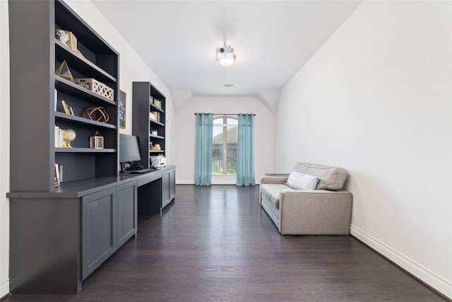 home office with dark wood finished floors, baseboards, and vaulted ceiling