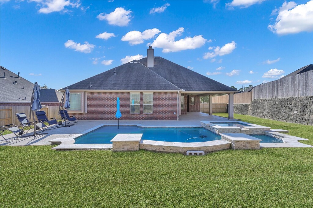 311 Arbor Trail Ln, Conroe, TX 77384 - view of pool featuring a patio and a pool with connected hot tub
