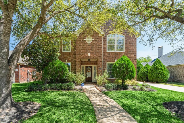 11018 Jadestone Creek Ln, Cypress, TX 77433 - traditional home featuring brick siding and a front yard