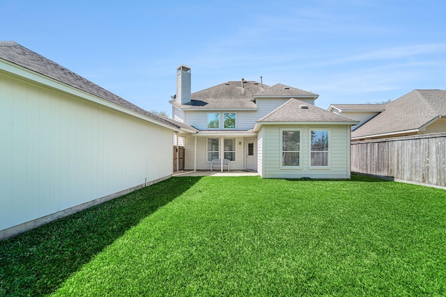 11018 Jadestone Creek Ln, Cypress, TX 77433 - back of house featuring a patio and a chimney