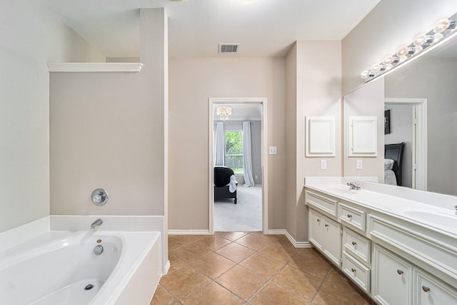 11018 Jadestone Creek Ln, Cypress, TX 77433 - ensuite bathroom with double vanity, a garden tub, tile patterned flooring, and baseboards