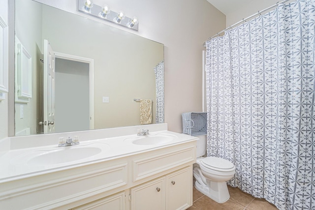 11018 Jadestone Creek Ln, Cypress, TX 77433 - bathroom with toilet, tile patterned floors, double vanity, and a shower with shower curtain