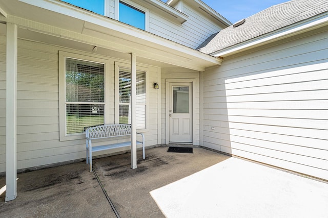 11018 Jadestone Creek Ln, Cypress, TX 77433 - view of exterior entry with covered porch and roof with shingles