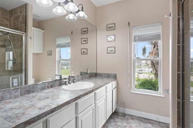 3802 Tidewater, Galveston, TX 77554 - bathroom featuring vanity, a stall shower, toilet, and healthy amount of natural light
