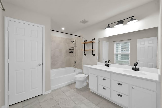 full bath with toilet, tile patterned flooring, double vanity, and shower / bath combination