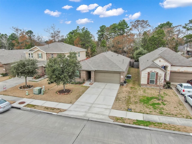 view of front of property featuring brick siding, an attached garage, concrete driveway, and roof with shingles