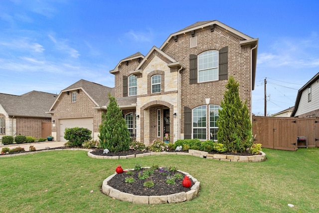 202 Bentwater Ln, Clute, TX 77531 - french country home featuring brick siding, an attached garage, and a gate