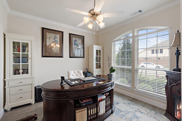 202 Bentwater Ln, Clute, TX 77531 - office featuring ceiling fan, light wood-style floors, and ornamental molding