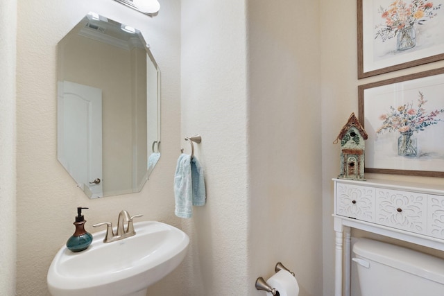 202 Bentwater Ln, Clute, TX 77531 - bathroom with toilet and a sink