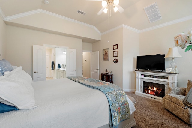 202 Bentwater Ln, Clute, TX 77531 - carpeted bedroom featuring vaulted ceiling, a fireplace, crown molding, ceiling fan, and baseboards