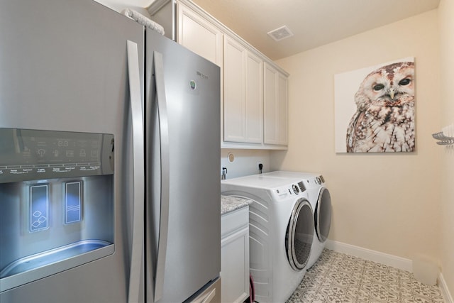 202 Bentwater Ln, Clute, TX 77531 - laundry room featuring washer and dryer, baseboards, and cabinet space