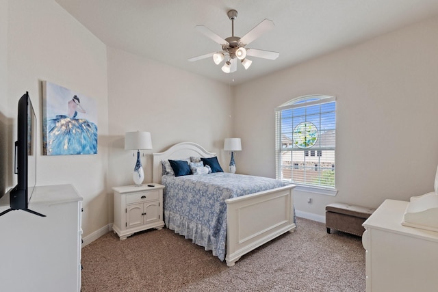 202 Bentwater Ln, Clute, TX 77531 - bedroom featuring light carpet, baseboards, and a ceiling fan