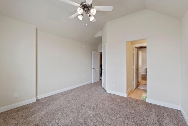 202 Bentwater Ln, Clute, TX 77531 - unfurnished bedroom with vaulted ceiling, light carpet, baseboards, and a ceiling fan