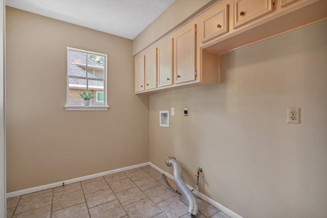 laundry room featuring baseboards, electric dryer hookup, cabinet space, and washer hookup