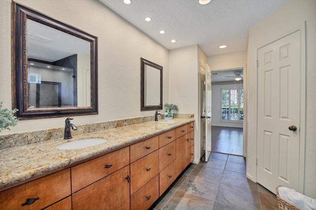 bathroom with recessed lighting, double vanity, tile patterned flooring, and ceiling fan
