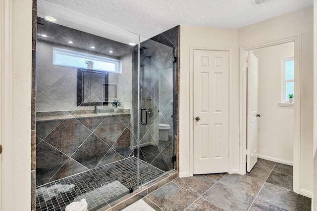 full bathroom with a shower stall, baseboards, and recessed lighting