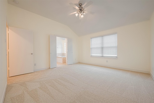 3722 Main Poplar Dr, Houston, TX 77025 - spare room with light colored carpet, vaulted ceiling, baseboards, ceiling fan, and a sink