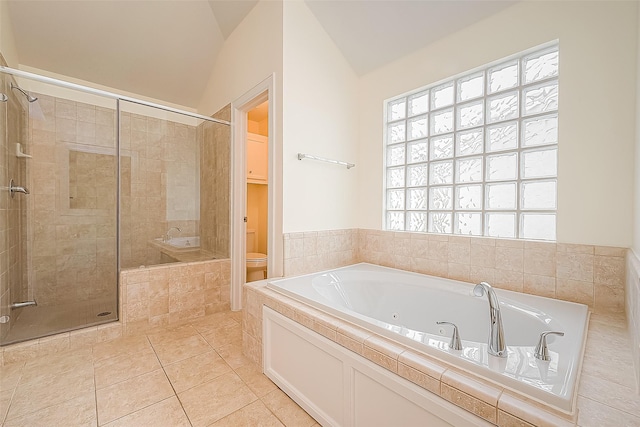 3722 Main Poplar Dr, Houston, TX 77025 - full bathroom with a stall shower, a whirlpool tub, toilet, lofted ceiling, and tile patterned flooring