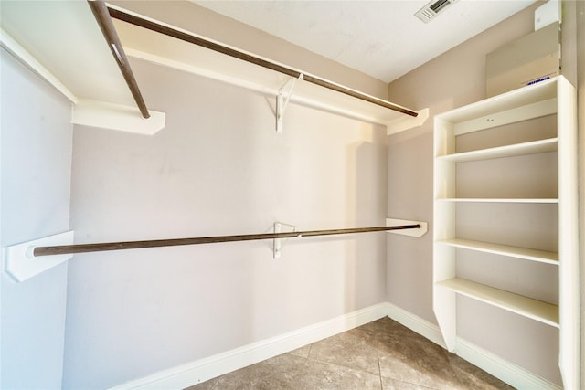 7810 Broken Arrow St, Baytown, TX 77521 - spacious closet featuring tile patterned floors
