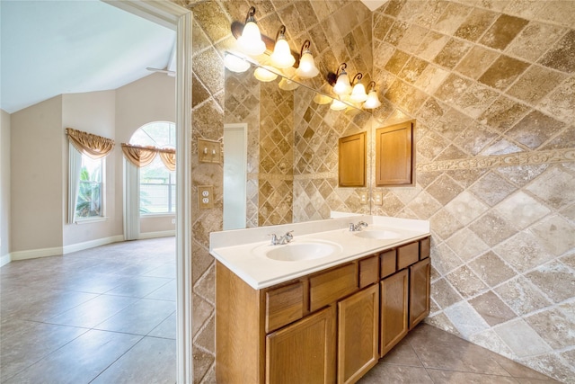 7810 Broken Arrow St, Baytown, TX 77521 - full bath featuring lofted ceiling, baseboards, tile patterned flooring, double vanity, and a chandelier