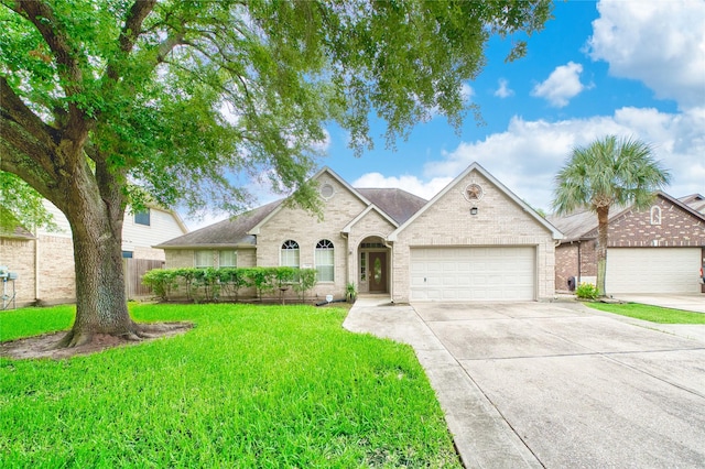 7810 Broken Arrow St, Baytown, TX 77521 - view of front facade featuring brick siding, concrete driveway, a garage, and a shingled roof