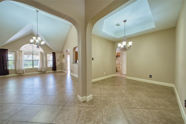 7810 Broken Arrow St, Baytown, TX 77521 - spare room with a chandelier, light tile patterned floors, arched walkways, baseboards, and vaulted ceiling