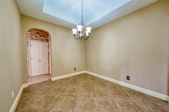 7810 Broken Arrow St, Baytown, TX 77521 - tiled empty room with a chandelier, arched walkways, and baseboards