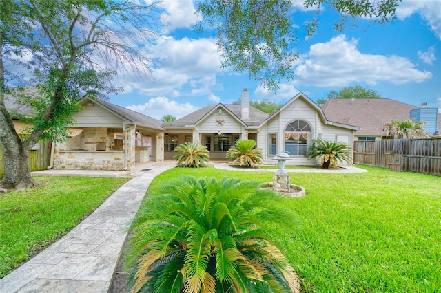 7810 Broken Arrow St, Baytown, TX 77521 - back of property with a chimney and stone siding