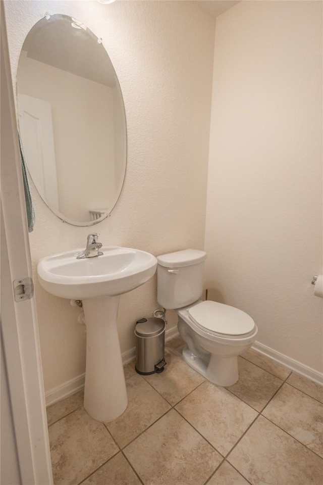 2786 Cayden Creek Way, Conroe, TX 77304 - bathroom with toilet, tile patterned floors, and baseboards