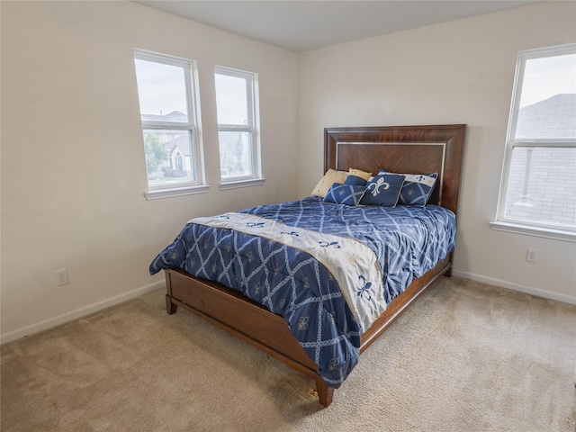 2786 Cayden Creek Way, Conroe, TX 77304 - carpeted bedroom featuring multiple windows and baseboards