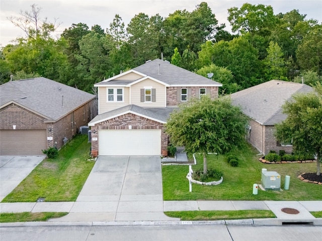 2786 Cayden Creek Way, Conroe, TX 77304 - traditional-style home with driveway, stone siding, and a front yard