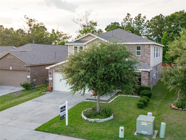 2786 Cayden Creek Way, Conroe, TX 77304 - view of front of home featuring brick siding, concrete driveway, a front yard, and an attached garage