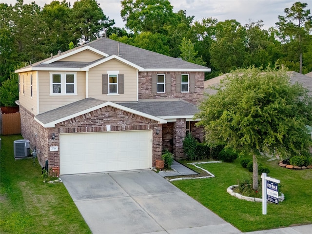 2786 Cayden Creek Way, Conroe, TX 77304 - view of front of property with driveway, roof with shingles, brick siding, and an attached garage