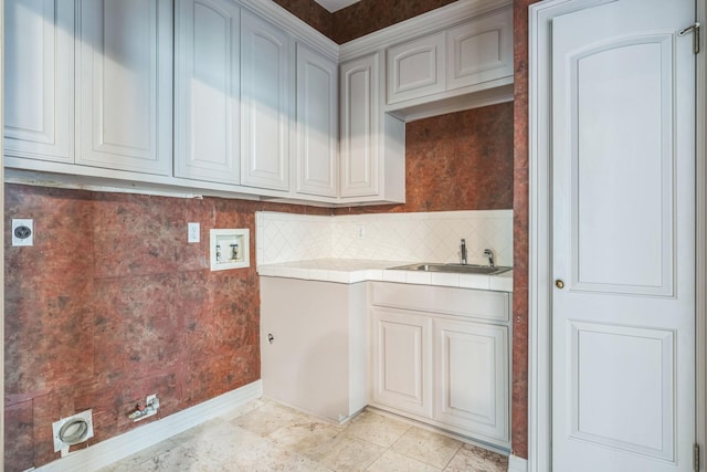 21 Aston Gln, San Antonio, TX 78257 - laundry room featuring washer hookup, electric dryer hookup, cabinet space, and baseboards