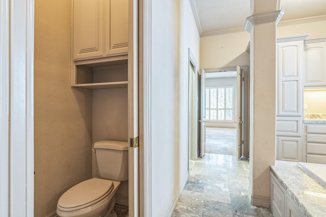 21 Aston Gln, San Antonio, TX 78257 - bathroom featuring stone tile flooring, crown molding, vanity, baseboards, and toilet