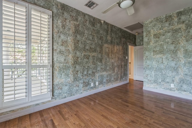 21 Aston Gln, San Antonio, TX 78257 - spare room featuring a ceiling fan, wood finished floors, baseboards, plenty of natural light, and wallpapered walls