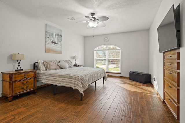 13102 Lake Mist Dr, Cypress, TX 77429 - bedroom with dark wood finished floors, a ceiling fan, and a textured ceiling