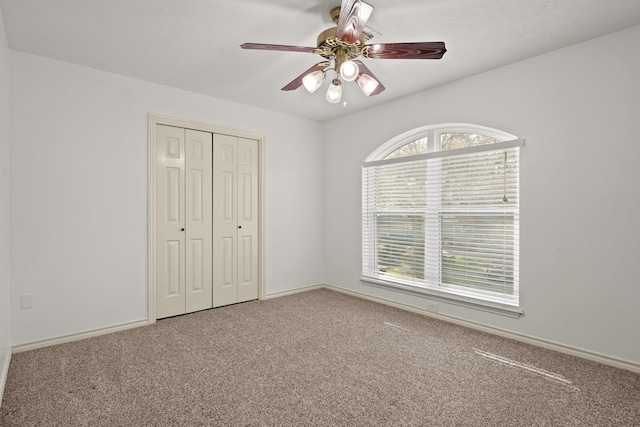 13102 Lake Mist Dr, Cypress, TX 77429 - unfurnished bedroom featuring carpet, a closet, baseboards, and a ceiling fan