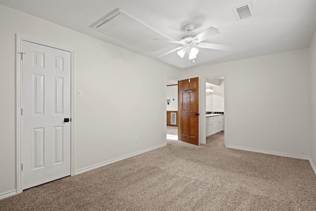 13102 Lake Mist Dr, Cypress, TX 77429 - spare room with attic access, carpet flooring, a ceiling fan, and baseboards