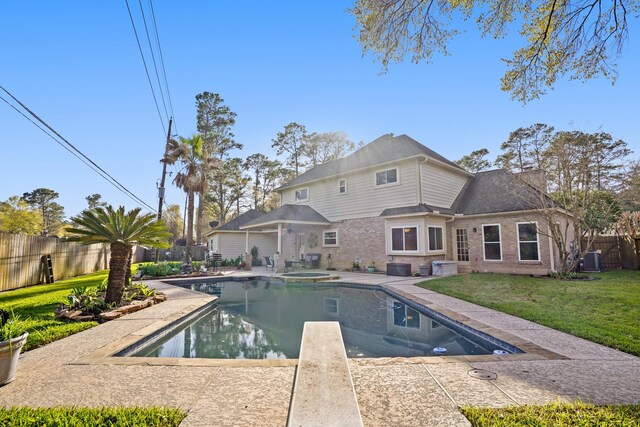 13102 Lake Mist Dr, Cypress, TX 77429 - view of swimming pool featuring a fenced backyard, a patio area, and a pool with connected hot tub