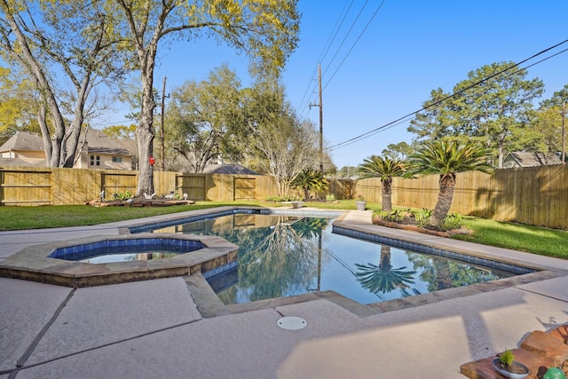 13102 Lake Mist Dr, Cypress, TX 77429 - view of swimming pool featuring a pool with connected hot tub and a fenced backyard